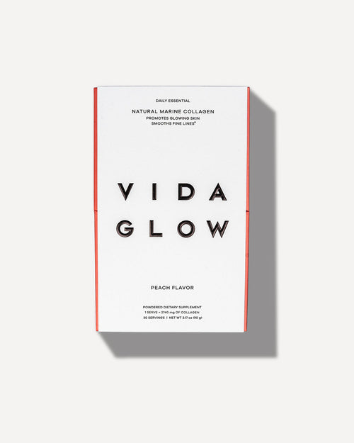 Box of Natural Marine Collagen | VIDA GLOW peach-flavored dietary supplement with a clean white and coral design promoting glowing skin and smoothing fine lines.