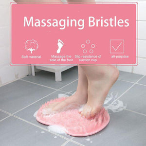 Feet using a pink Back & Foot Scrubber | Dreambox Beauty with soft massaging bristles on a tiled floor, showing slip-resistant suction cups for stability during body care and skincare routines.