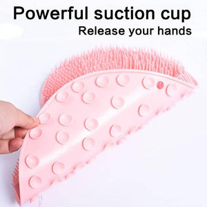 Close-up of a pink Back & Foot Scrubber | Dreambox Beauty with flexible silicone bristles and powerful suction cups designed for hands-free body care and skincare routines.