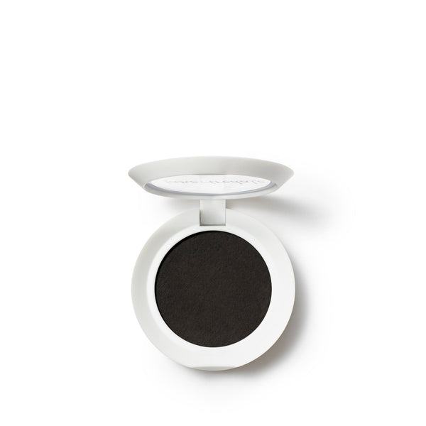 Open compact of PureBrow Brow Powder | Jane Iredale showing deep black brow powder in a white round case against a white background.