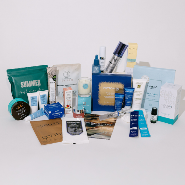 2026 Wellness Month Box ($1,140+ Value) | Live Love Spa featuring a curated collection of skincare, body care, wellness supplements, and recovery tools in an elegant blue box.