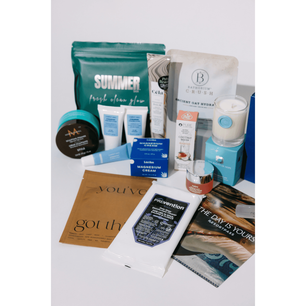 2026 Wellness Month Box ($1,140+ Value) | Live Love Spa featuring a curated collection of skincare, body care, wellness supplements, and recovery tools in an elegant blue box.