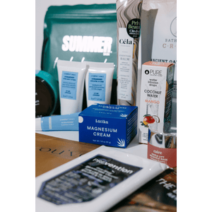 Assorted skincare, wellness supplements, and body care products displayed together, representing the 2026 Wellness Month Box ($1,140+ Value) | Live Love Spa collection.