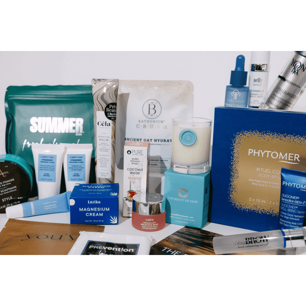 2026 Wellness Month Box ($1,140+ Value) | Live Love Spa featuring a variety of skincare products, body care items, wellness supplements, and recovery tools arranged together for holistic wellness.