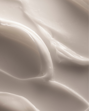 Close-up of smooth, creamy texture of Restore Ceramides + Gotu Kola Barrier Repair Cream | Three Ships, highlighting its rich skincare consistency.