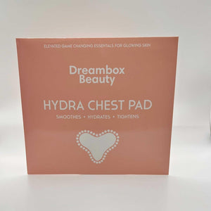 Packaging of Hydrating Reusable Chest Pad | Dreambox Beauty in soft peach color highlighting benefits to smooth, hydrate, and tighten skin for glowing chest care.