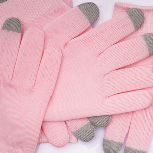 Close-up of soft pink gloves with gray fingertips designed for skincare, showcasing Hydrating Infused Moisturizing Gloves | Dreambox Beauty for enhanced hand hydration and wellness.