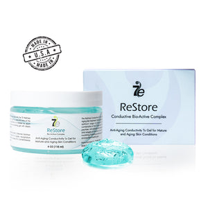 ReStore Conductive Gel with Bio-Active Complex | 7e Wellness in a clear jar with white lid next to its white and light blue box, showing a dollop of translucent blue gel for skincare and body care.