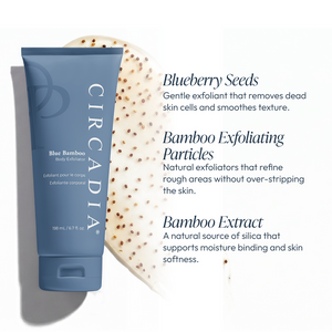 Blue Bamboo Exfoliator for Body | Circadia in a blue tube next to exfoliating cream with visible bamboo particles and blueberry seeds, highlighting natural skincare ingredients for smooth, soft skin.