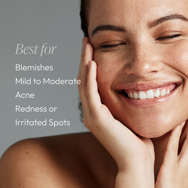Smiling woman with clear skin touching her face next to text listing benefits for blemishes, mild to moderate acne, redness, and irritated spots, promoting Spot Stop Blemish Corrector | Circadia.