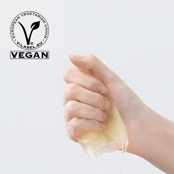 Hand squeezing a translucent gel with the vegan certification label visible, representing ImPHYTO Vitamin | Leaders skincare or wellness supplement product quality.