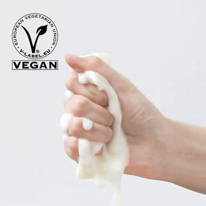 Hand squeezing thick white foam with a vegan certification logo, promoting ImPHYTO Ceramide | Leaders skincare product.