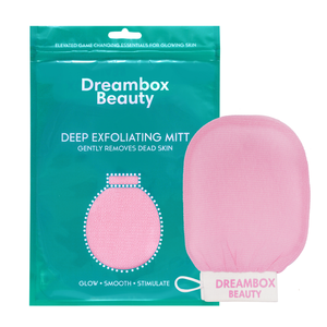 Pink DEEP Exfoliating Mitt | Dreambox Beauty displayed next to its teal packaging, designed for skincare to gently remove dead skin and promote glowing, smooth skin.