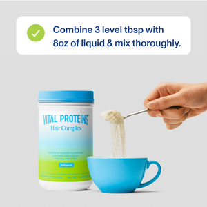 Hand holding a spoonful of Hair Complex - Unflavored | Vital Proteins powder above a blue cup with instructions to combine 3 level tablespoons with 8 ounces of liquid and mix thoroughly.