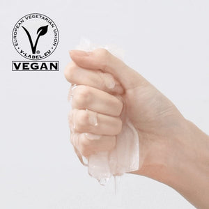 Hand squeezing clear, gel-like skincare product with visible moisture droplets, featuring a vegan certification symbol, highlighting ImPHYTO Mucin | Leaders for skin wellness.