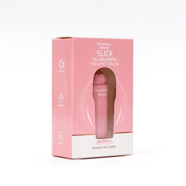 Packaging of the Slick Oil Absorbing Volcanic Roller [Removes Oil & Shine] | Dreambox Beauty, a pink skincare tool designed to absorb oil and reduce shine for a refreshed complexion.