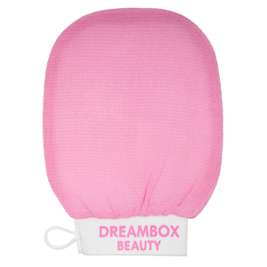 Pink textured exfoliating mitt with elastic wristband embroidered with DREAMBOX BEAUTY, designed for skincare and body care use with the DEEP Exfoliating Mitt | Dreambox Beauty.
