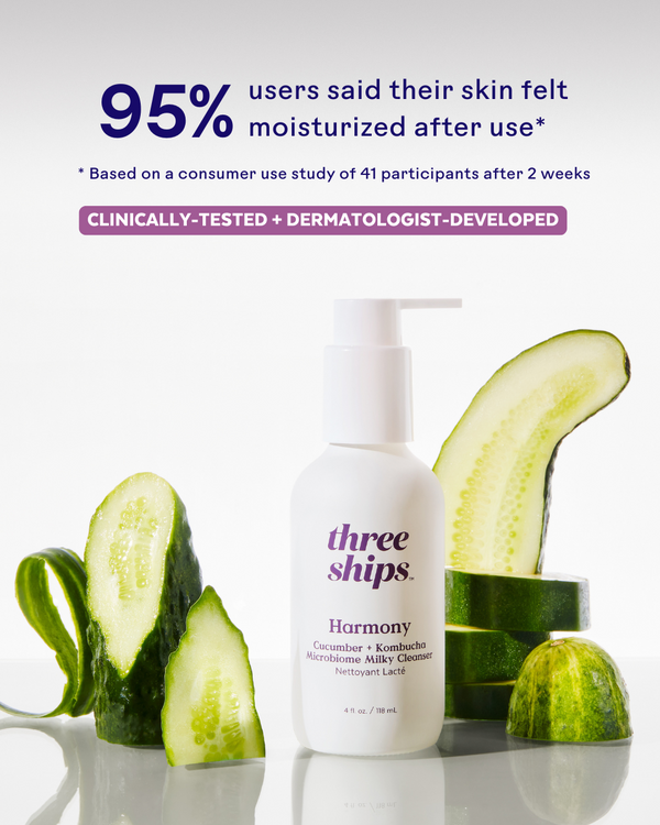 Bottle of Harmony Cucumber + Kombucha Microbiome Milky Balancing Cleanser | Three Ships surrounded by fresh cucumber slices, highlighting its moisturizing skincare benefits.