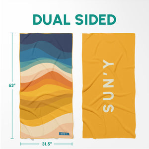 Dual sided Waffle Microfiber Beach Towel - Boho | SUN'Y with colorful wave pattern on one side and solid mustard yellow with white SUN'Y logo on the other, measuring 63 by 31.5 inches.