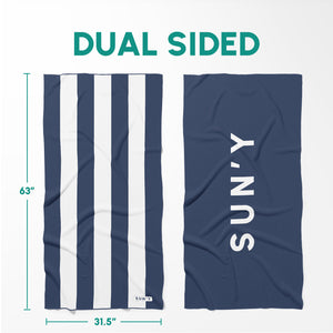 Waffle Microfiber Beach Towel - Nautical Navy | SUN'Y showing dual-sided design with navy and white stripes on one side and solid navy with brand name on the other.