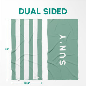 Waffle Microfiber Beach Towel - Sea Green | SUN'Y shown with its dual-sided design featuring green and white stripes on one side and solid sea green with SUN'Y branding on the other.