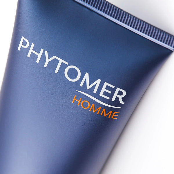 Close-up of the blue tube of Aqua Optimal Face and Eyes Soothing Moisturizer | Phytomer, highlighting the brand name Phytomer Homme on the packaging, a skincare product for men.