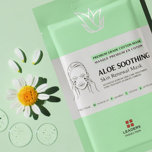 A close-up of the Aloe Soothing Skin Renewal Mask | Leaders packaging next to chamomile flower petals and clear gel droplets, highlighting calming skincare ingredients.