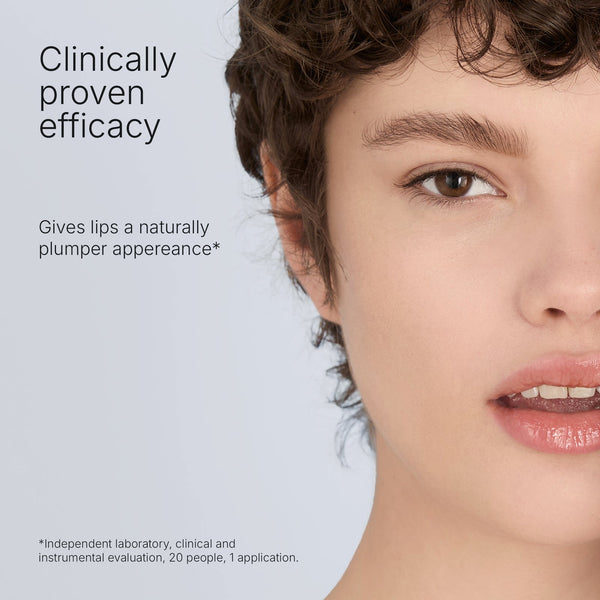 Close-up of a woman with natural makeup showcasing glossy, plump lips, highlighting the Hydramemory Plumping Lip Balm | [ comfort zone ] benefits for skincare and lip care.