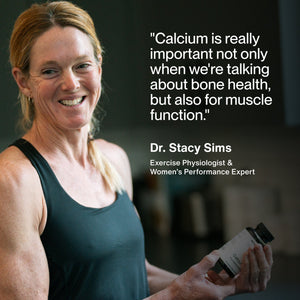 Calcium wellness supplement bottle held by Dr Stacy Sims alongside a quote about bone health and muscle function