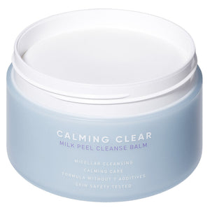 Open jar of Calming Clear Milk Peel Cleanse Balm | Leaders in a light blue container designed for skincare cleansing and calming care.