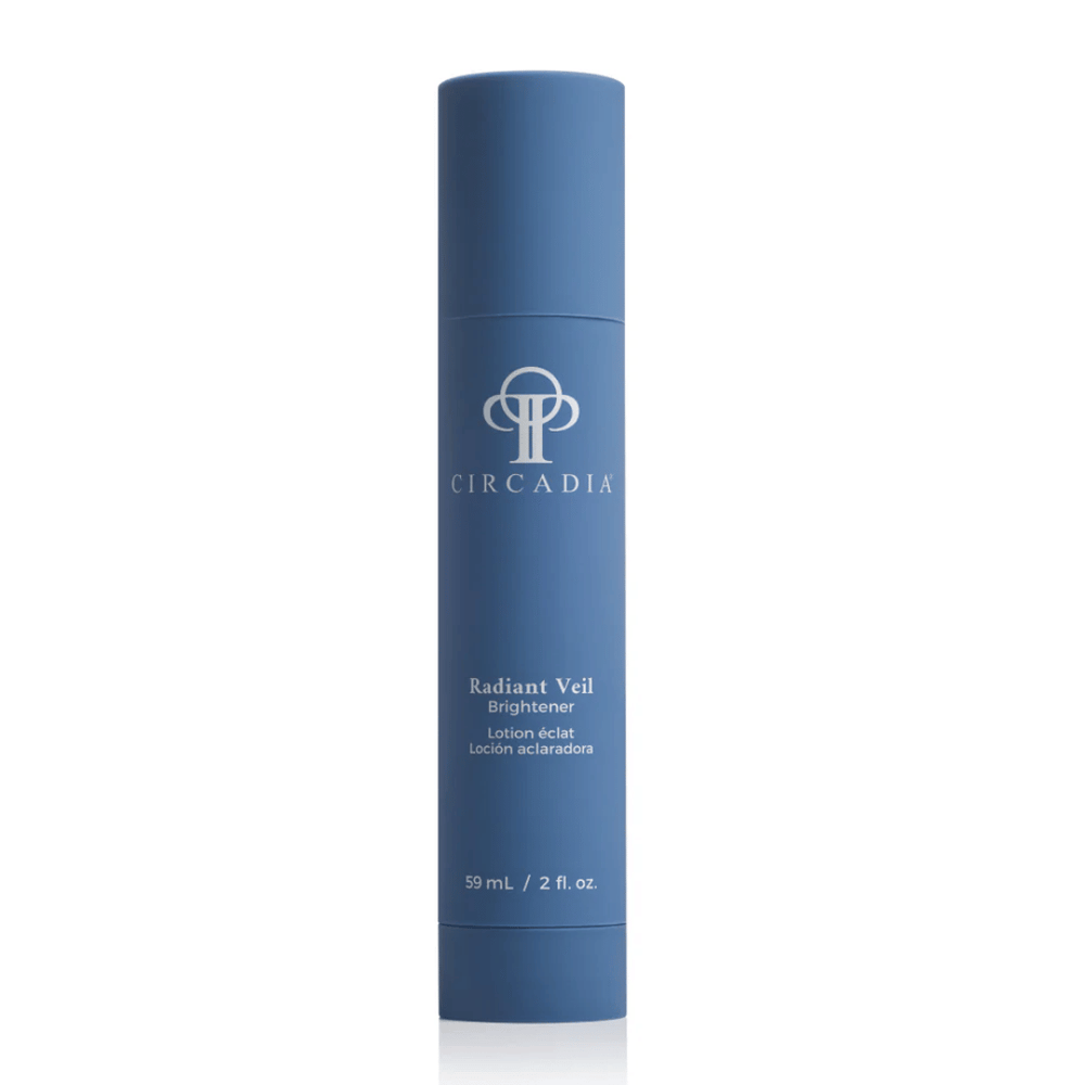 Blue cylindrical skincare bottle with white text displaying Radiant Veil Brightener (formerly White Veil Brightener) | Circadia, emphasizing a clean and elegant design for wellness and body care.