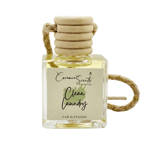 Car Diffuser | CommonScents by Tayler E featuring a clean laundry scent in a clear glass bottle with a wooden cap and braided hanging rope for fresh car fragrance.