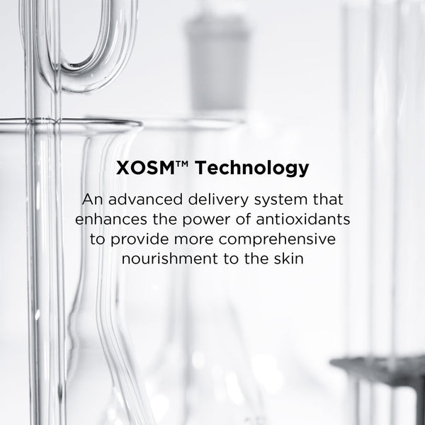 Close-up of clear laboratory glassware with text highlighting XOSM Technology as an advanced delivery system that enhances antioxidants for comprehensive skin nourishment in DAILY PREVENTION Ultra Defense Moisturizer SPF 50 | IMAGE Skincare.