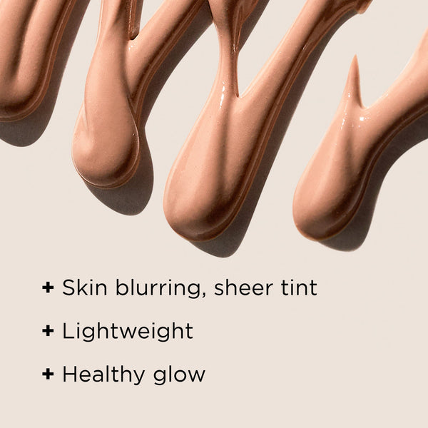 Close-up of creamy beige tinted moisturizer texture swirled on a surface, highlighting skin blurring, sheer tint, lightweight feel, and healthy glow for DAILY PREVENTION pure mineral tinted moisturizer SPF 30 | IMAGE Skincare.