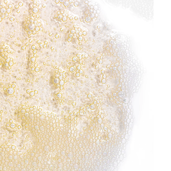 Close-up view of foamy, golden bubbles from Deep Pore Cleanser Normal/Combination Skin | Skin Fitness Therapy, highlighting its rich, cleansing texture for skincare.