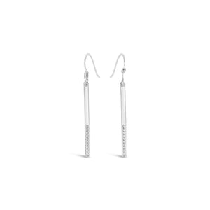 Pair of sleek silver drop earrings with a slim bar design accented by small sparkling stones, styled as Love Light Earrings | Little Sparkles.