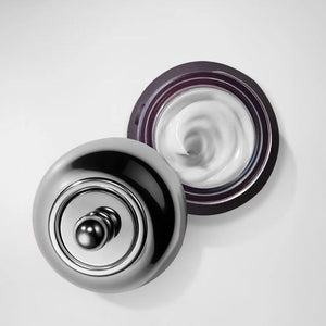 Open jar of Eye Repair Peptide Complex | blinc showing smooth white cream texture in elegant container for skincare and wellness supplements.