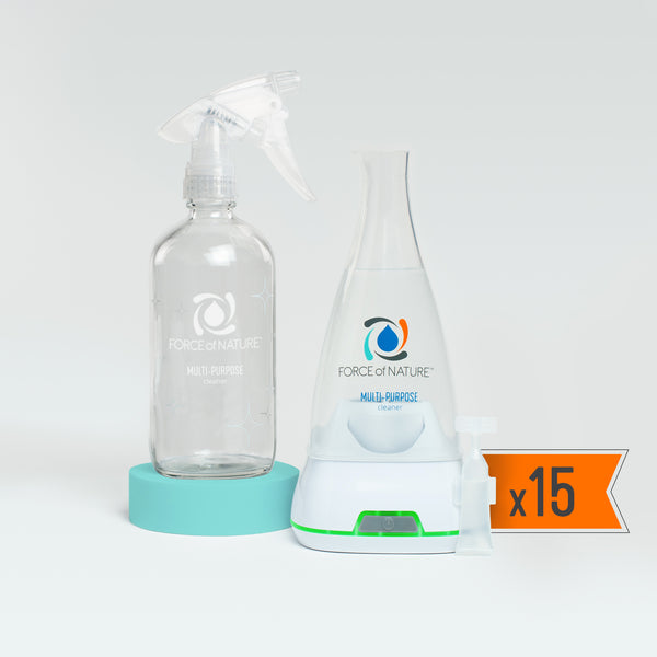 12oz Glass Bottle Cleaning Starter Kit | Force of Nature showing a clear glass spray bottle, a white and teal cleaning generator, and cleaning capsules with a label indicating 15 capsules included.