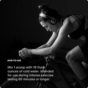 Fuel wellness supplement usage graphic showing a woman cycling indoors with instructions to mix one scoop with 16 fluid ounces of cold water for intense exercise