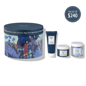 Gift set featuring skincare products with artistic blue and purple packaging including a cleansing mask, cream, and hydramemory balm from Kit Night Garden | [ comfort zone ] valued at $240.