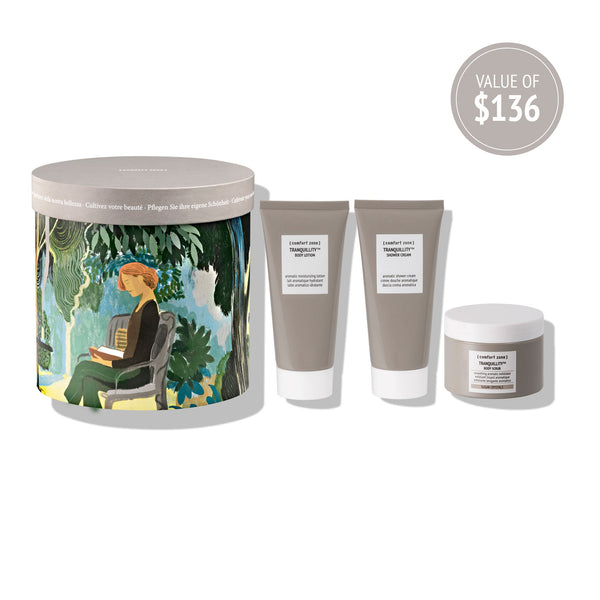 Kit Secret Garden | [ comfort zone ] skincare set displayed with artistic packaging featuring a seated woman in a garden and three taupe-colored body care tubes and jar.