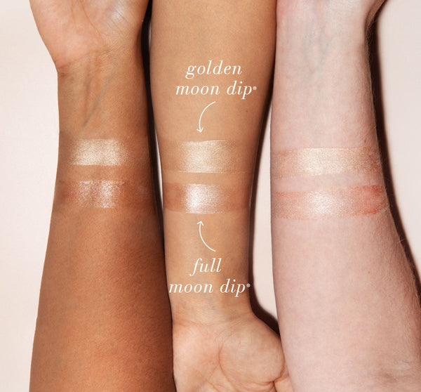 Swatches of Golden Moon Dip® Illumination Mousse with Retinol + Wrinkle-Targeting Peptides | Farmhouse Fresh on three different skin tones showing luminous, shimmering effects for skincare and body care.