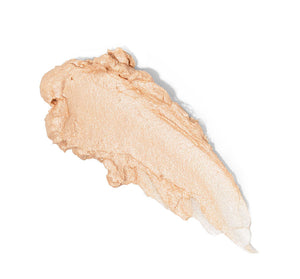 Swatch of Golden Moon Dip® Illumination Mousse with Retinol + Wrinkle-Targeting Peptides | Farmhouse Fresh showing a creamy, light beige skincare mousse texture for radiant skin care.