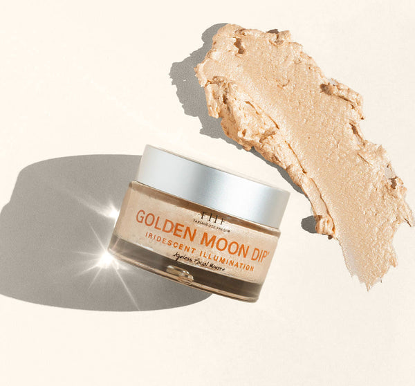 Golden Moon Dip® Illumination Mousse with Retinol + Wrinkle-Targeting Peptides | Farmhouse Fresh in a glass jar with a silver lid, shown alongside a creamy iridescent mousse swatch for skincare and body care.