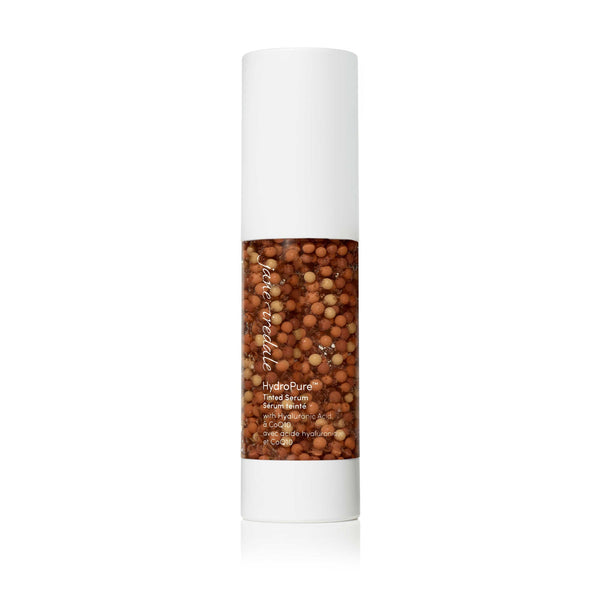 HydroPure™ Tinted Serum with Hyaluronic Acid & CoQ10 | Jane Iredale in a sleek white bottle featuring visible serum beads, designed for skincare enhancement and hydration.
