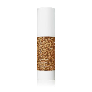 HydroPure™ Tinted Serum with Hyaluronic Acid & CoQ10 | Jane Iredale in a clear bottle with visible golden capsules inside, designed for skincare and hydration.