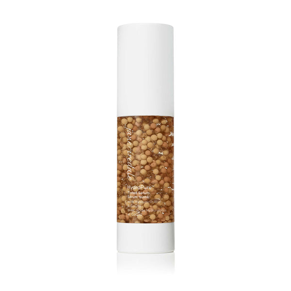 HydroPure™ Tinted Serum with Hyaluronic Acid & CoQ10 | Jane Iredale in a clear bottle with visible golden capsules inside, designed for skincare and hydration.
