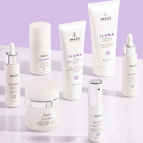 Collection of white skincare products with purple accents from IMAGE Skincare featuring ILUMA intense brightening exfoliating cleanser | IMAGE Skincare among other brightening body and face care items.