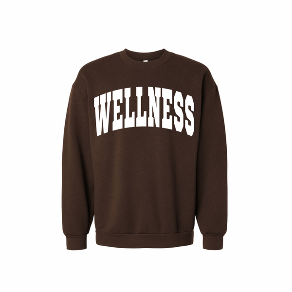 Wellness Varsity Unisex Crew Neck Sweatshirt | Lucky Owl in dark brown with bold white "WELLNESS" text across the chest, featuring a casual comfortable fit and ribbed cuffs and hem.