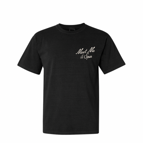 Black unisex t-shirt with a retro-inspired "Meet Me At The Spa" text design on the chest, ideal for casual wear and representing wellness and relaxation lifestyle. Meet Me At The Spa Retro Unisex T-Shirt | Lucky Owl